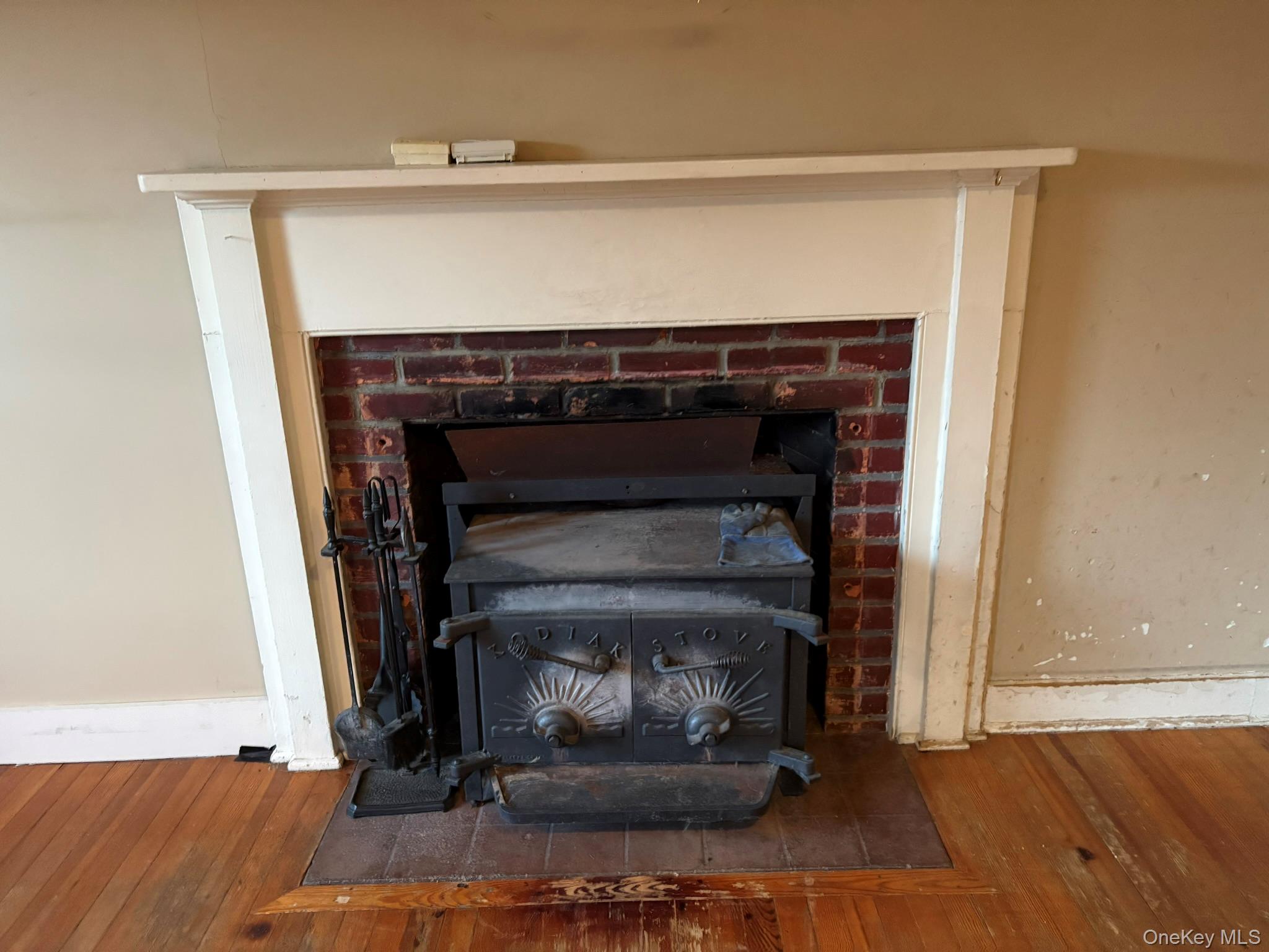 15 Sharon Valley Road Sharon, CT 06069 - Photo 11 of 26 a room with fireplace and a wooden floor