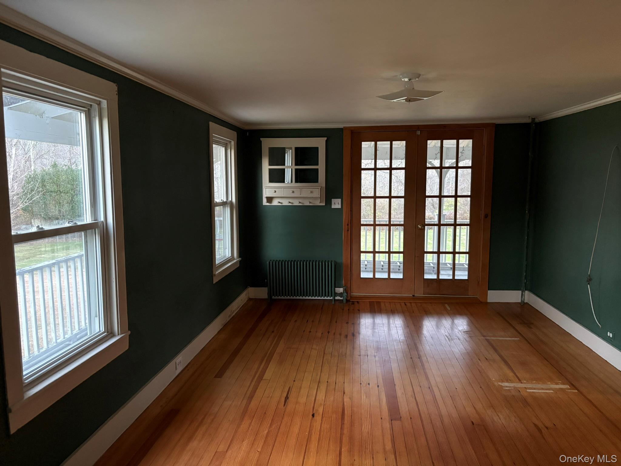 15 Sharon Valley Road Sharon, CT 06069 - Photo 12 of 26 a view of an empty room with wooden floor and a window