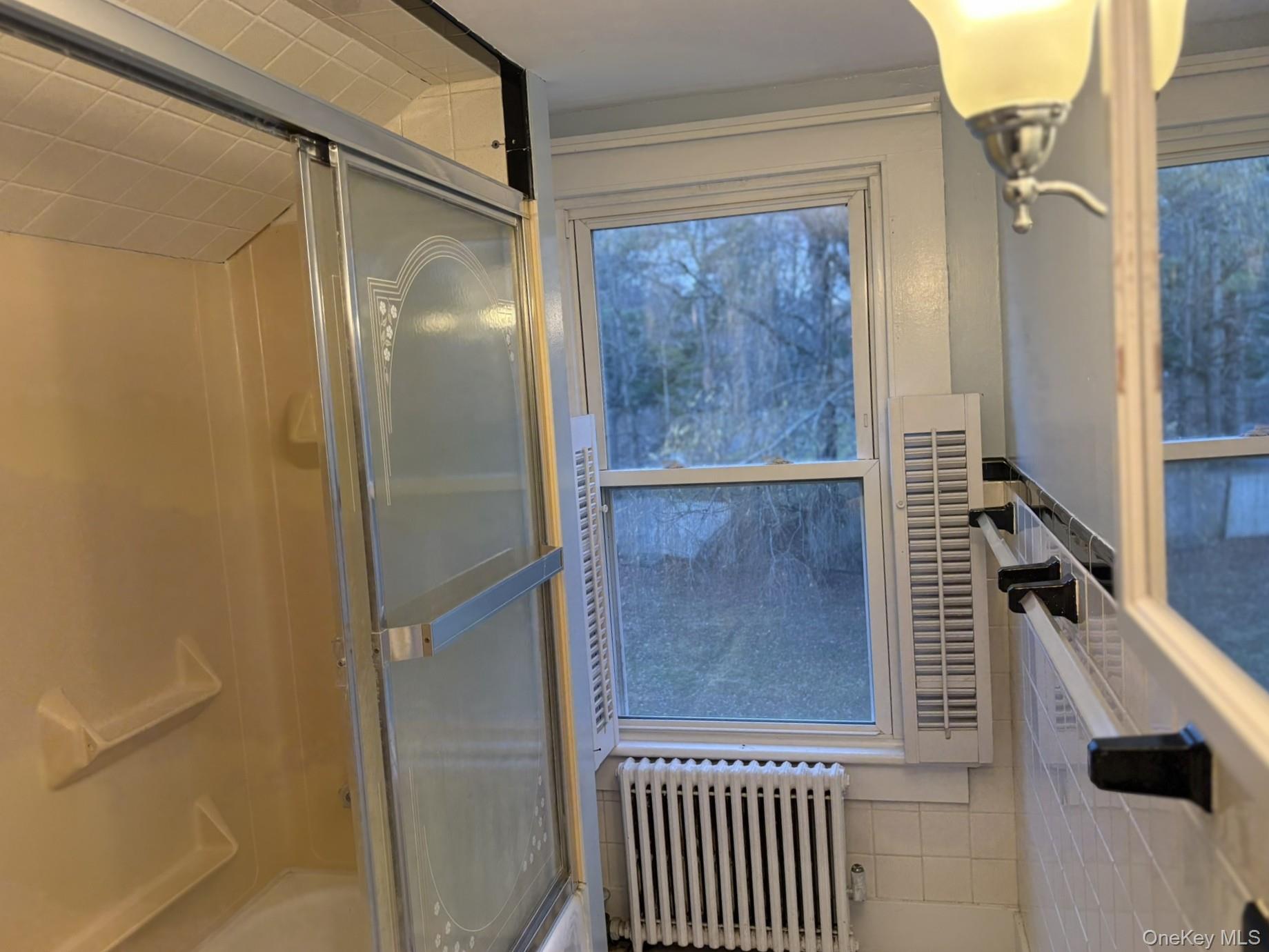15 Sharon Valley Road Sharon, CT 06069 - Photo 20 of 26 a bathroom with a bathtub and a shower