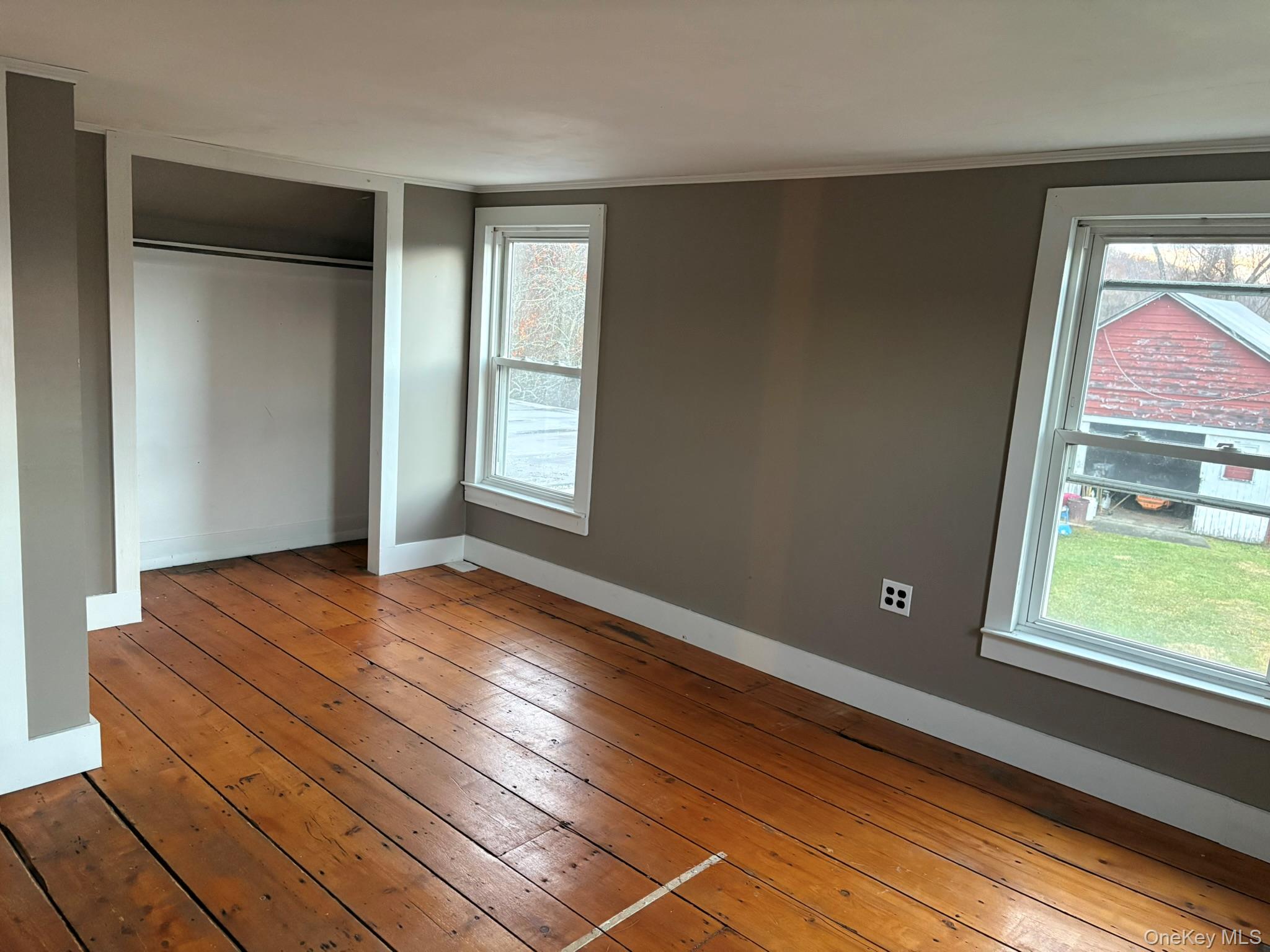 15 Sharon Valley Road Sharon, CT 06069 - Photo 21 of 26 a view of an empty room with wooden floor and a window