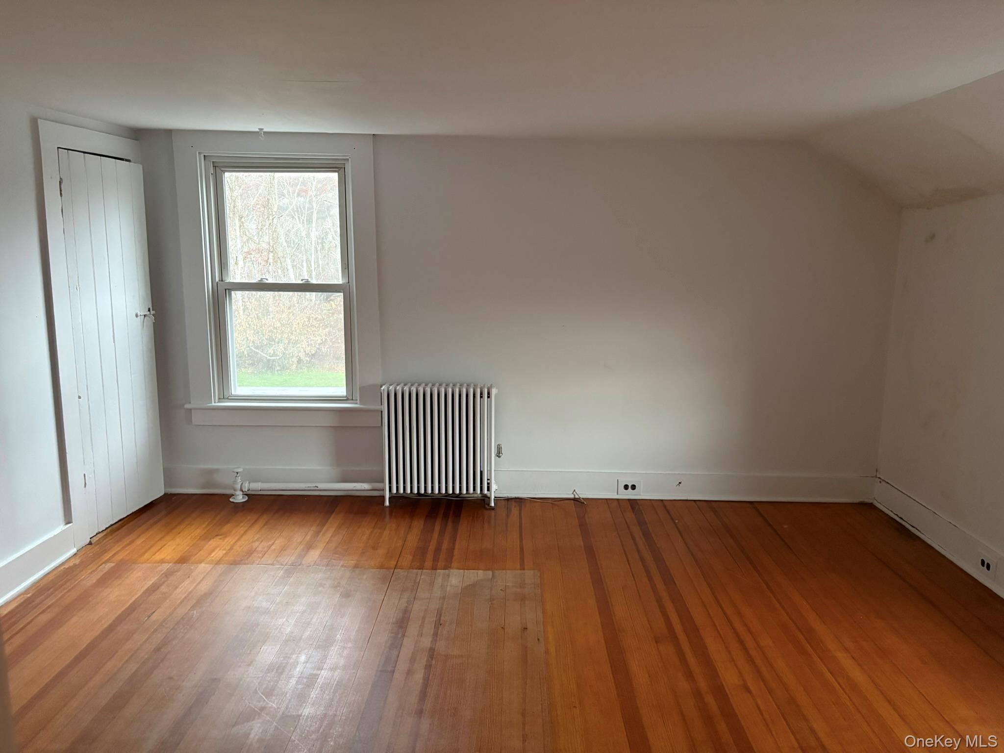 15 Sharon Valley Road Sharon, CT 06069 - Photo 23 of 26 an empty room with wooden floor and windows