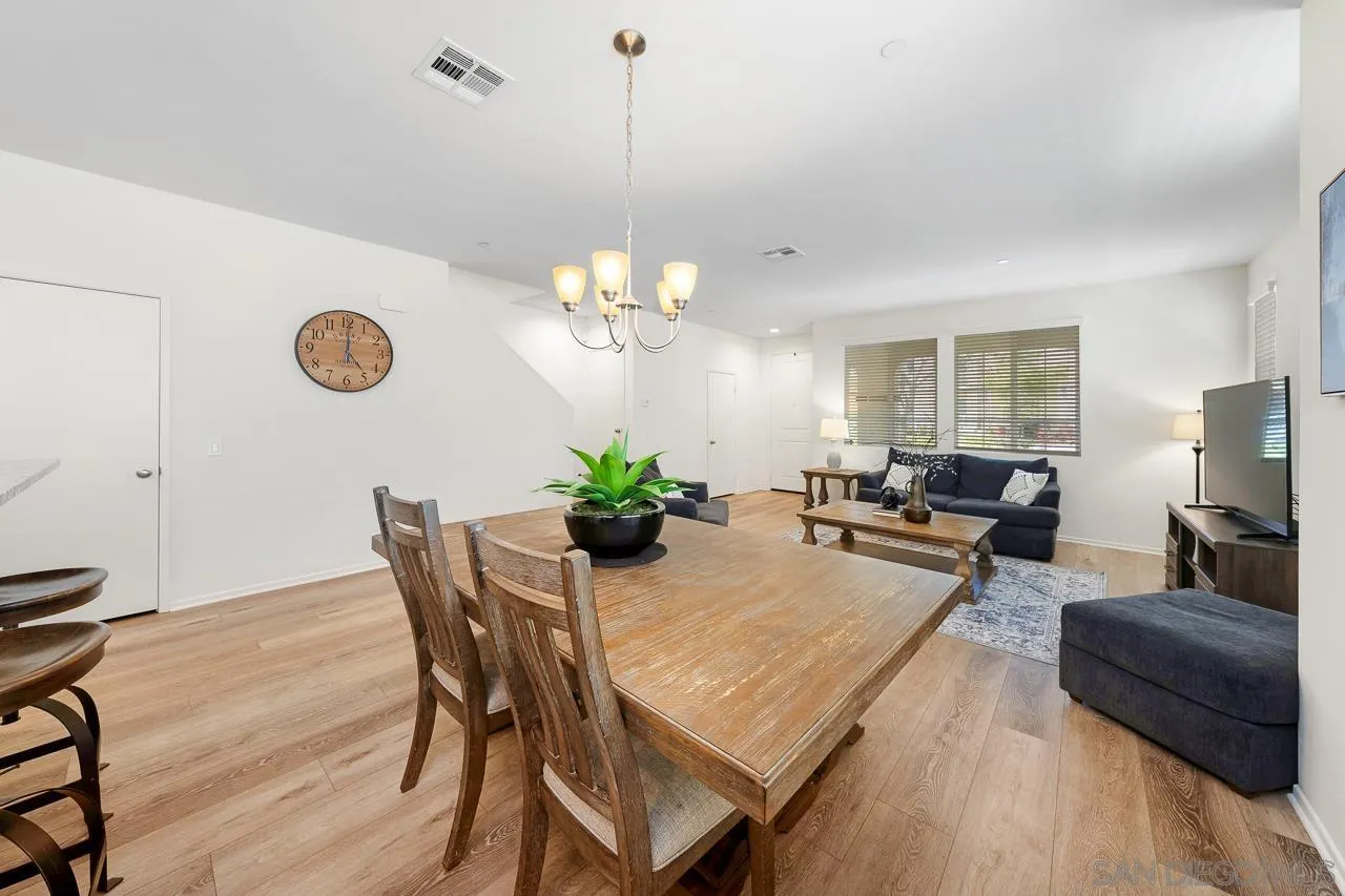 1290 Santa Victoria Road, Unit 2 Chula Vista, CA 91913 - Photo 14 of 41 a view of a dining room with furniture and a chandelier