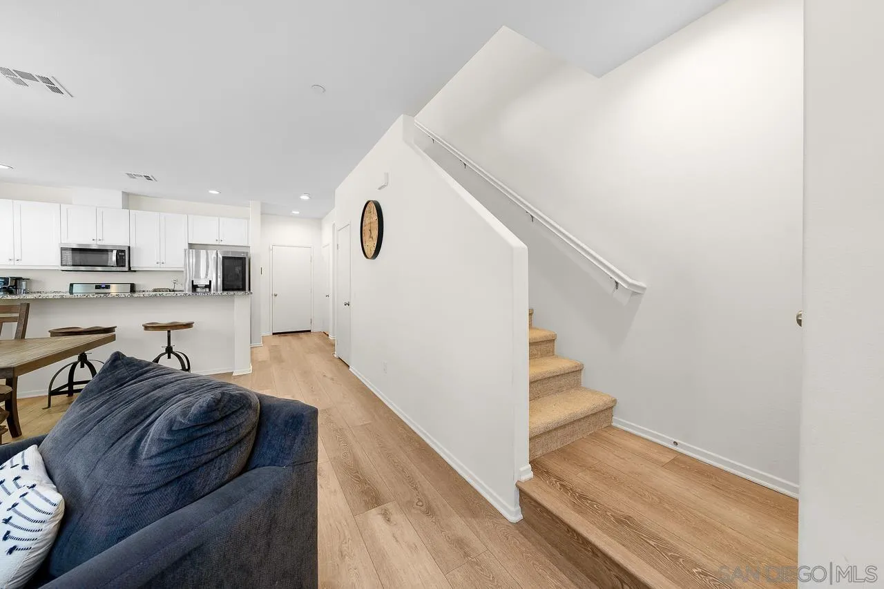 1290 Santa Victoria Road, Unit 2 Chula Vista, CA 91913 - Photo 16 of 41 a living room with stainless steel appliances kitchen island granite countertop furniture and a view of kitchen