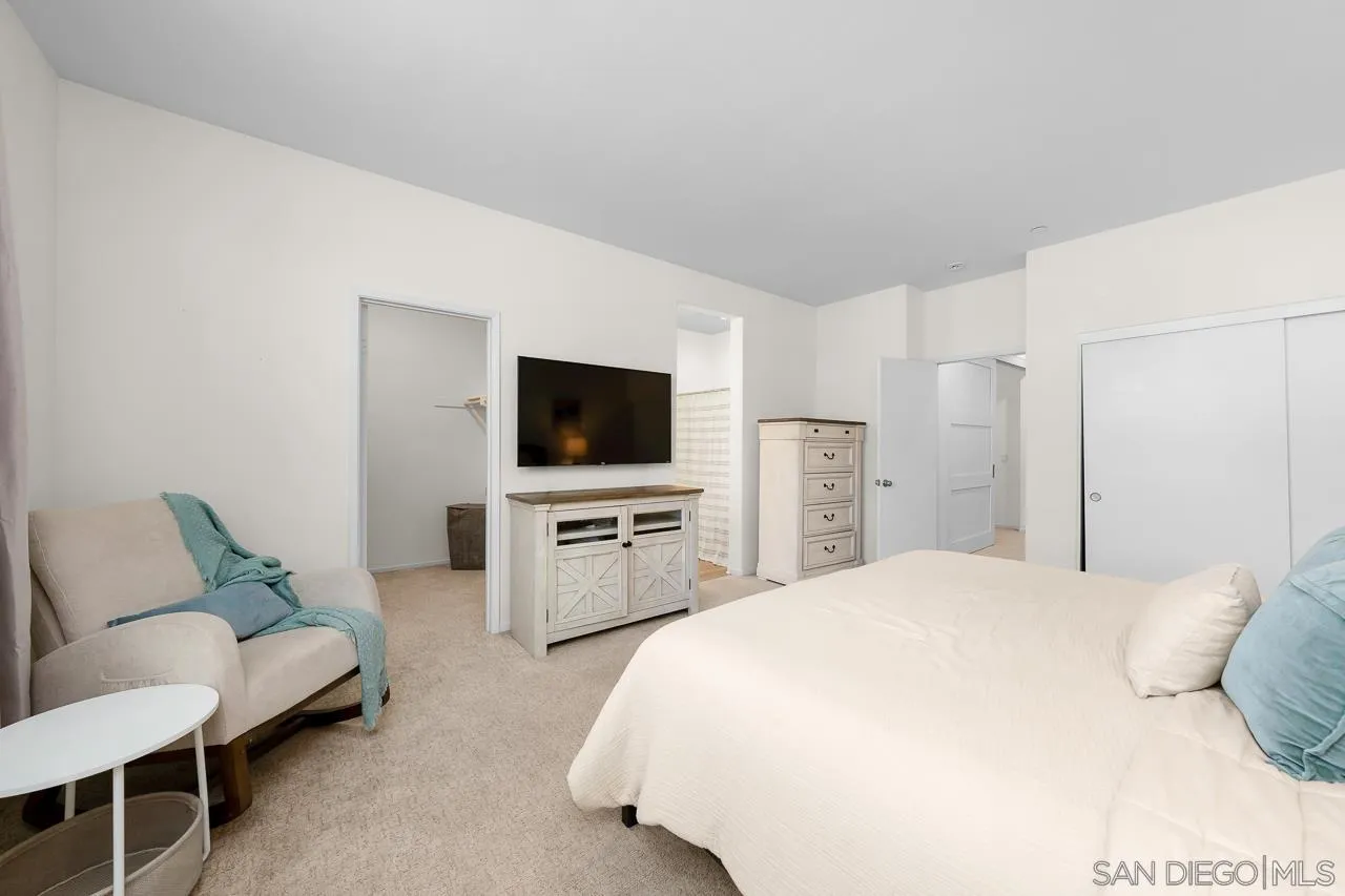 1290 Santa Victoria Road, Unit 2 Chula Vista, CA 91913 - Photo 21 of 41 a bedroom with a bed and a flat screen tv