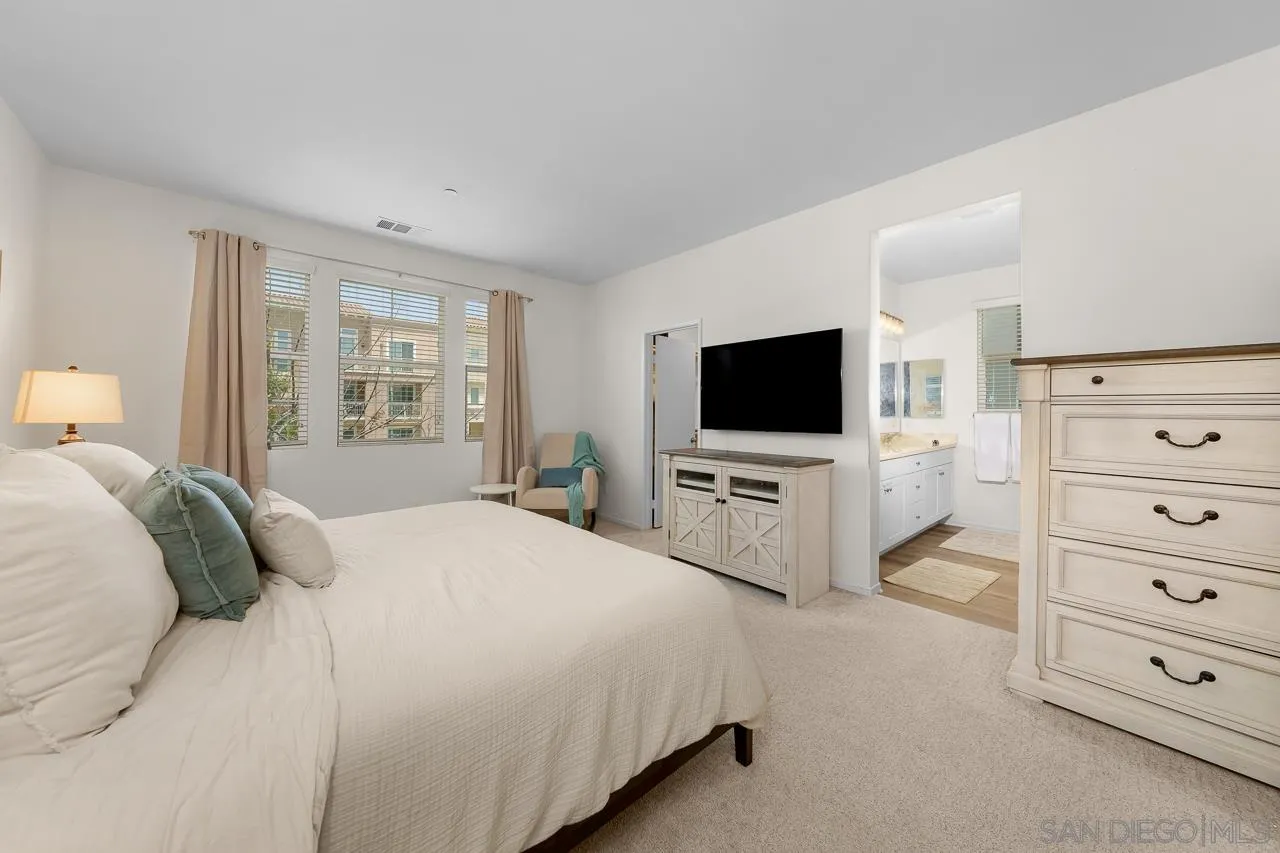 1290 Santa Victoria Road, Unit 2 Chula Vista, CA 91913 - Photo 22 of 41 a bedroom with a flat screen tv and a bed