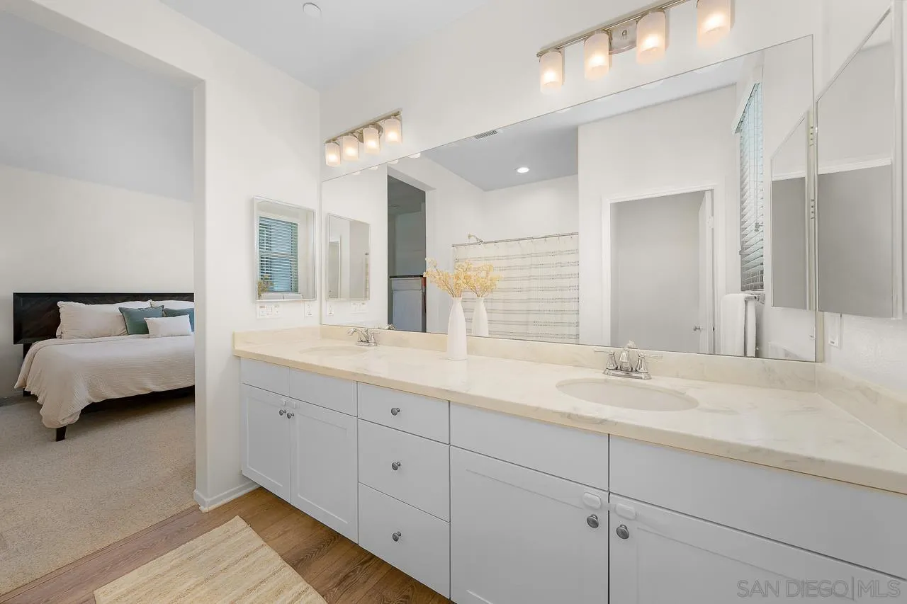 1290 Santa Victoria Road, Unit 2 Chula Vista, CA 91913 - Photo 23 of 41 a en suite bathroom with double sink and a mirror