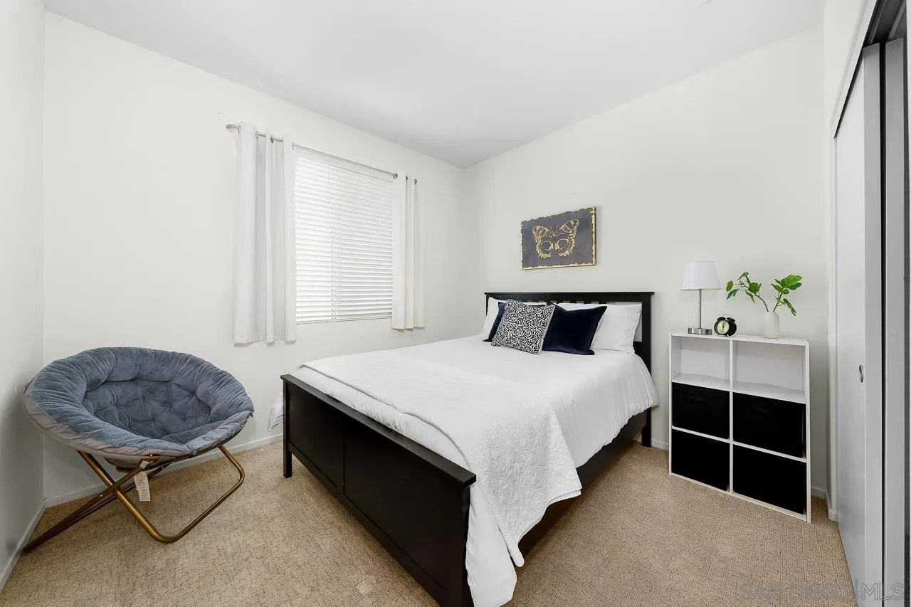 1290 Santa Victoria Road, Unit 2 Chula Vista, CA 91913 - Photo 25 of 41 a bedroom with a bed and a window