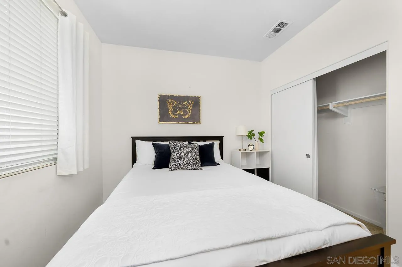 1290 Santa Victoria Road, Unit 2 Chula Vista, CA 91913 - Photo 26 of 41 a large bed in a white room