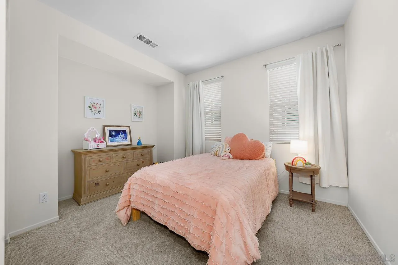 1290 Santa Victoria Road, Unit 2 Chula Vista, CA 91913 - Photo 27 of 41 a bedroom with a bed and a window