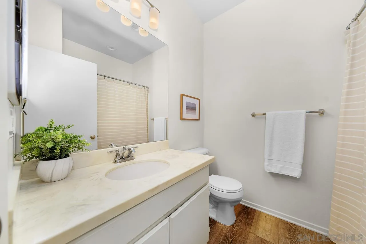 1290 Santa Victoria Road, Unit 2 Chula Vista, CA 91913 - Photo 30 of 41 a bathroom with a sink toilet and a mirror