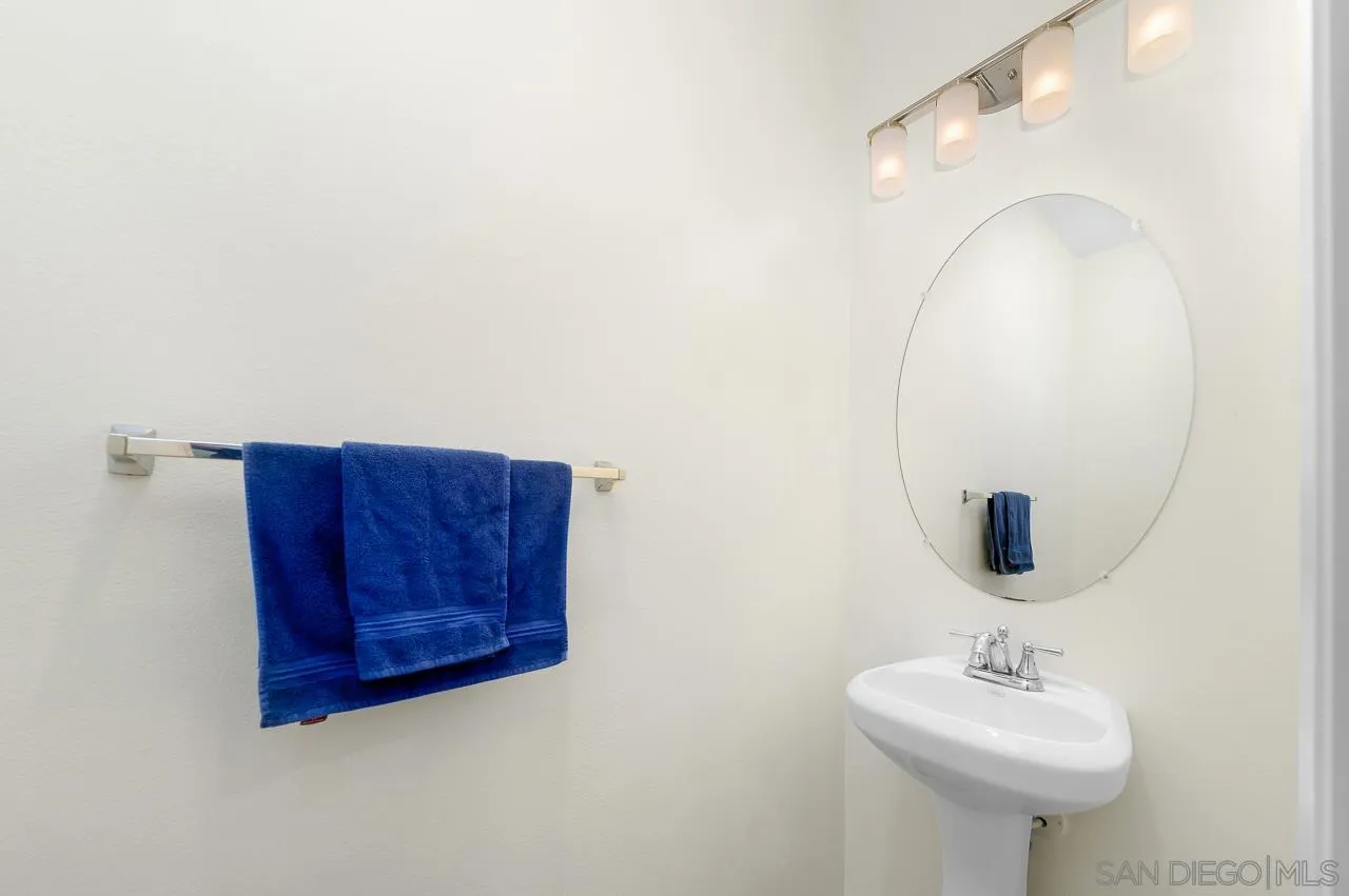 1290 Santa Victoria Road, Unit 2 Chula Vista, CA 91913 - Photo 31 of 41 a bathroom with a sink and a mirror