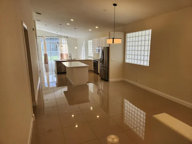 a kitchen with a sink appliances and cabinets
