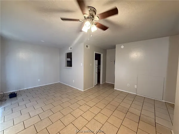 a view of an empty room and window