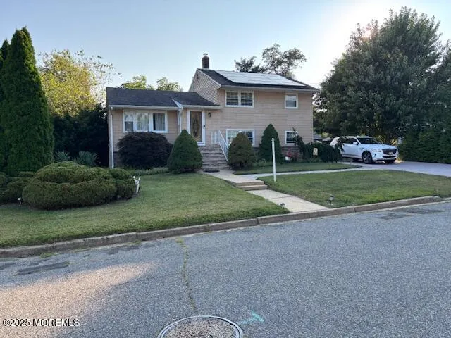 a view of a house with a yard