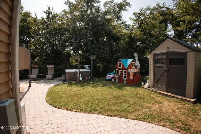 a view of a wooden house with a wooden fence
