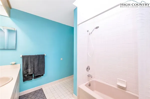 a bathroom with a toilet and a bathtub