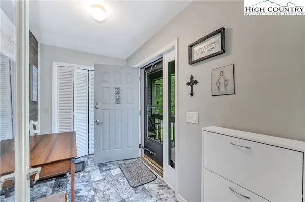 a view of room with window and hallway