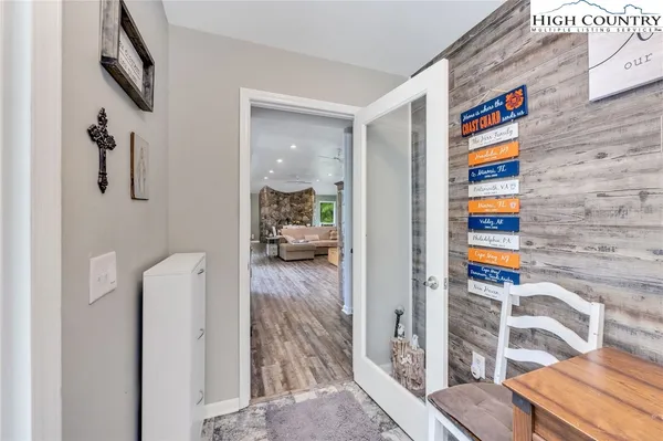 a living room with furniture and a book shelf