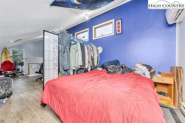 a bedroom with a bed and a lamp