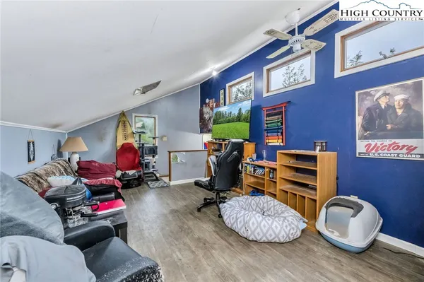 a room with furniture and a wooden floor