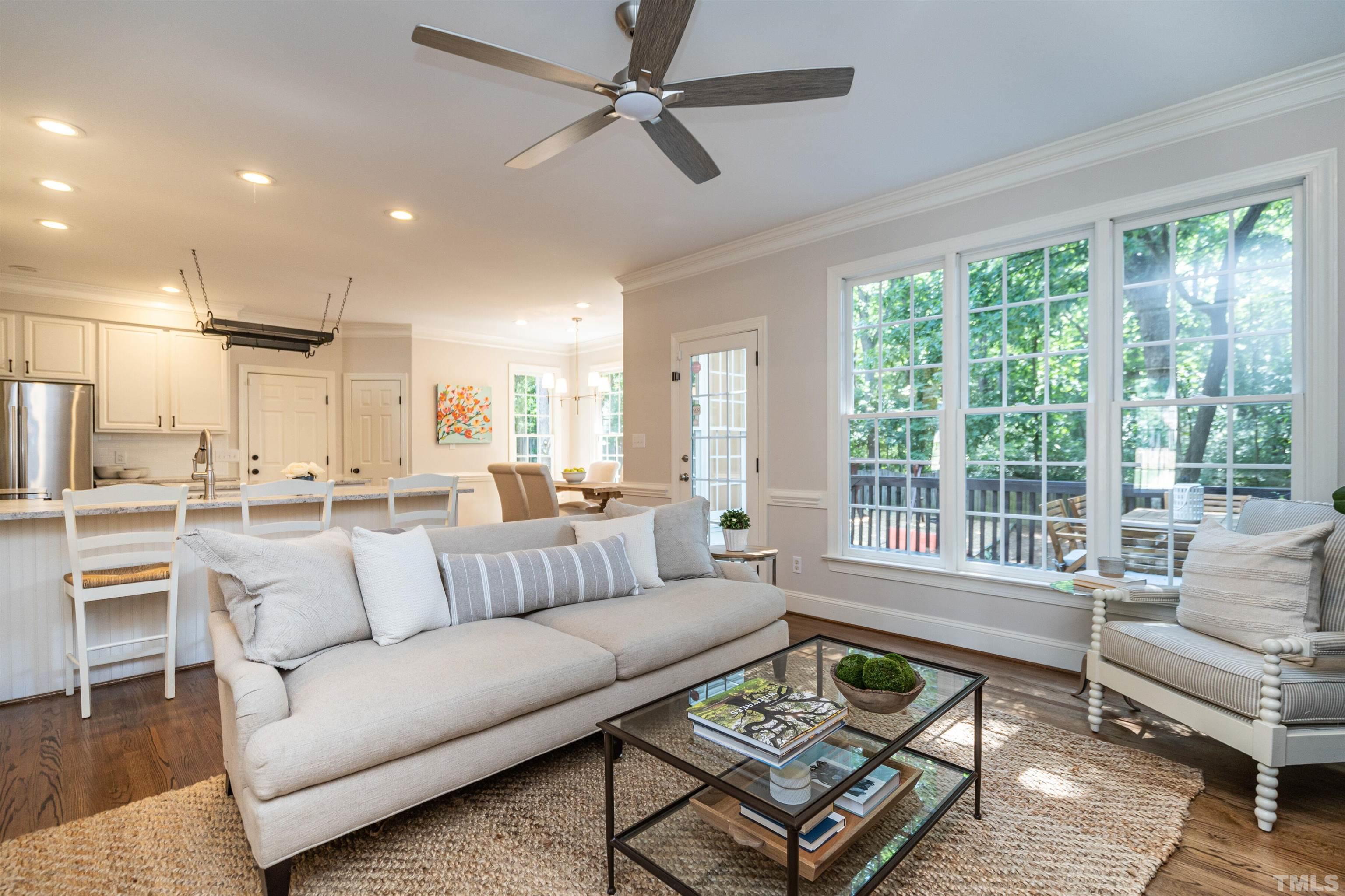 3016 Stone Gap Court Raleigh, NC 27612 - Photo 11 of 37 a living room with furniture and a large window