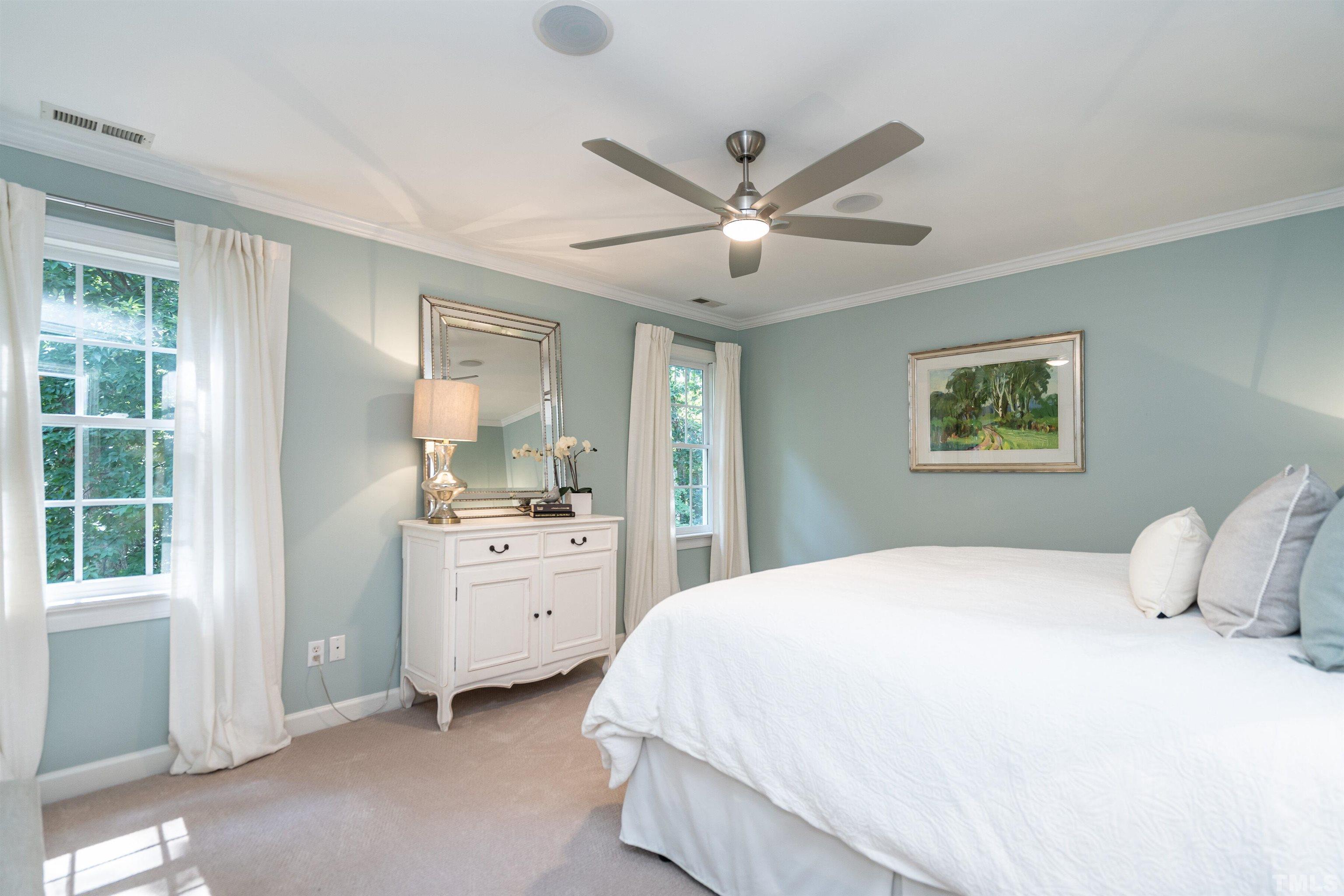 3016 Stone Gap Court Raleigh, NC 27612 - Photo 19 of 37 a bedroom with a large bed and a window
