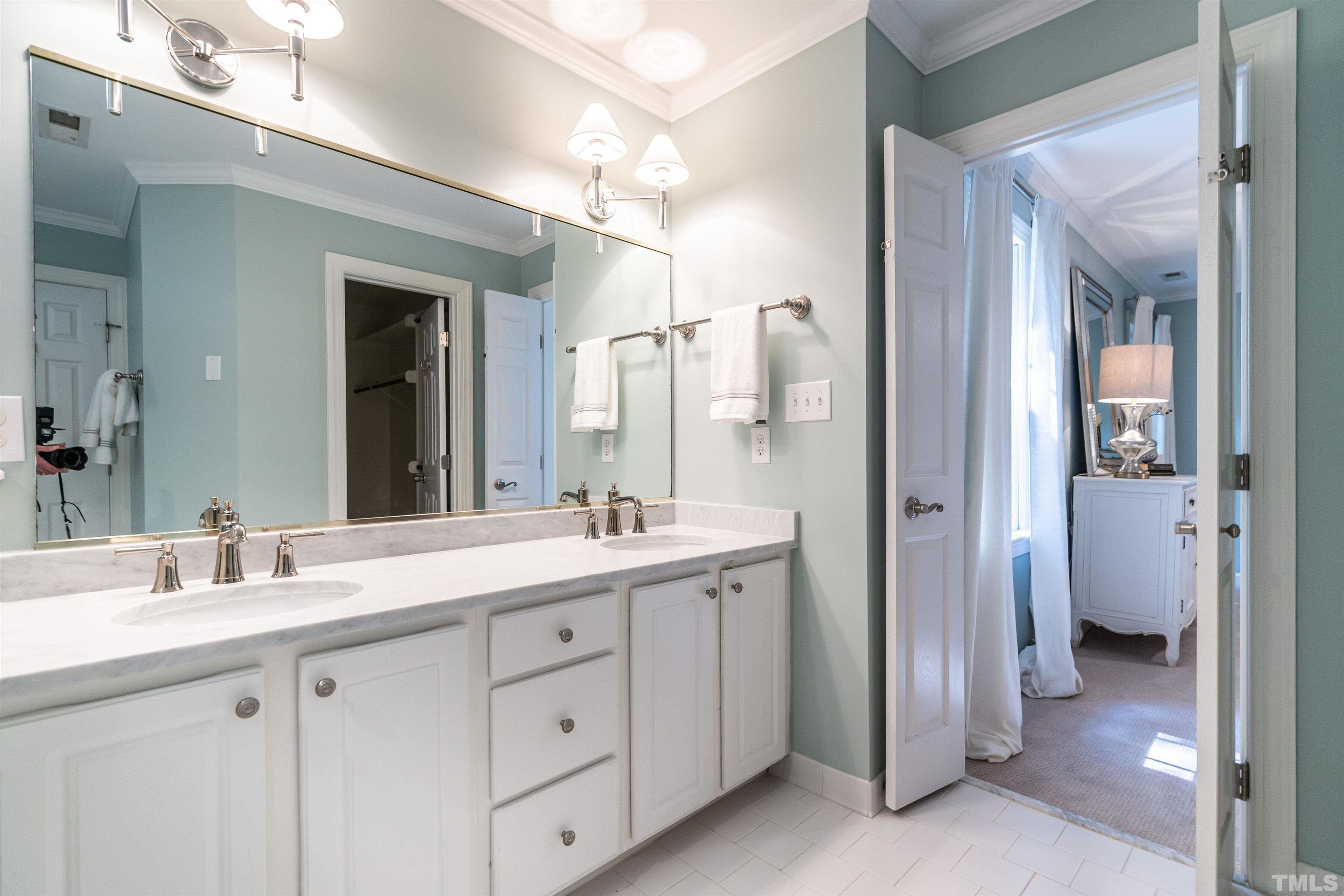 3016 Stone Gap Court Raleigh, NC 27612 - Photo 22 of 37 a spacious bathroom with a double vanity sink mirror and double