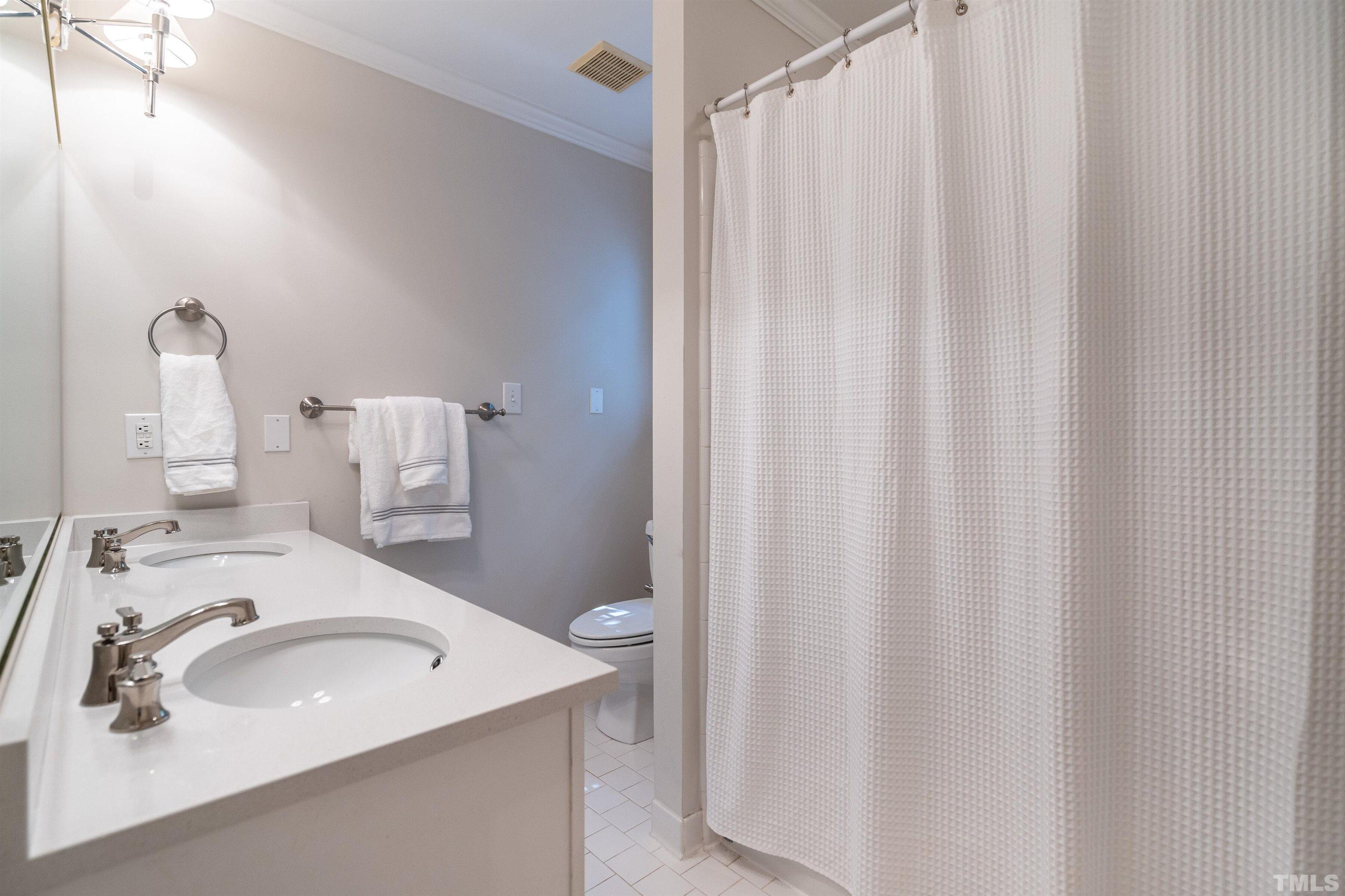 3016 Stone Gap Court Raleigh, NC 27612 - Photo 25 of 37 a bathroom with a sink and a sink
