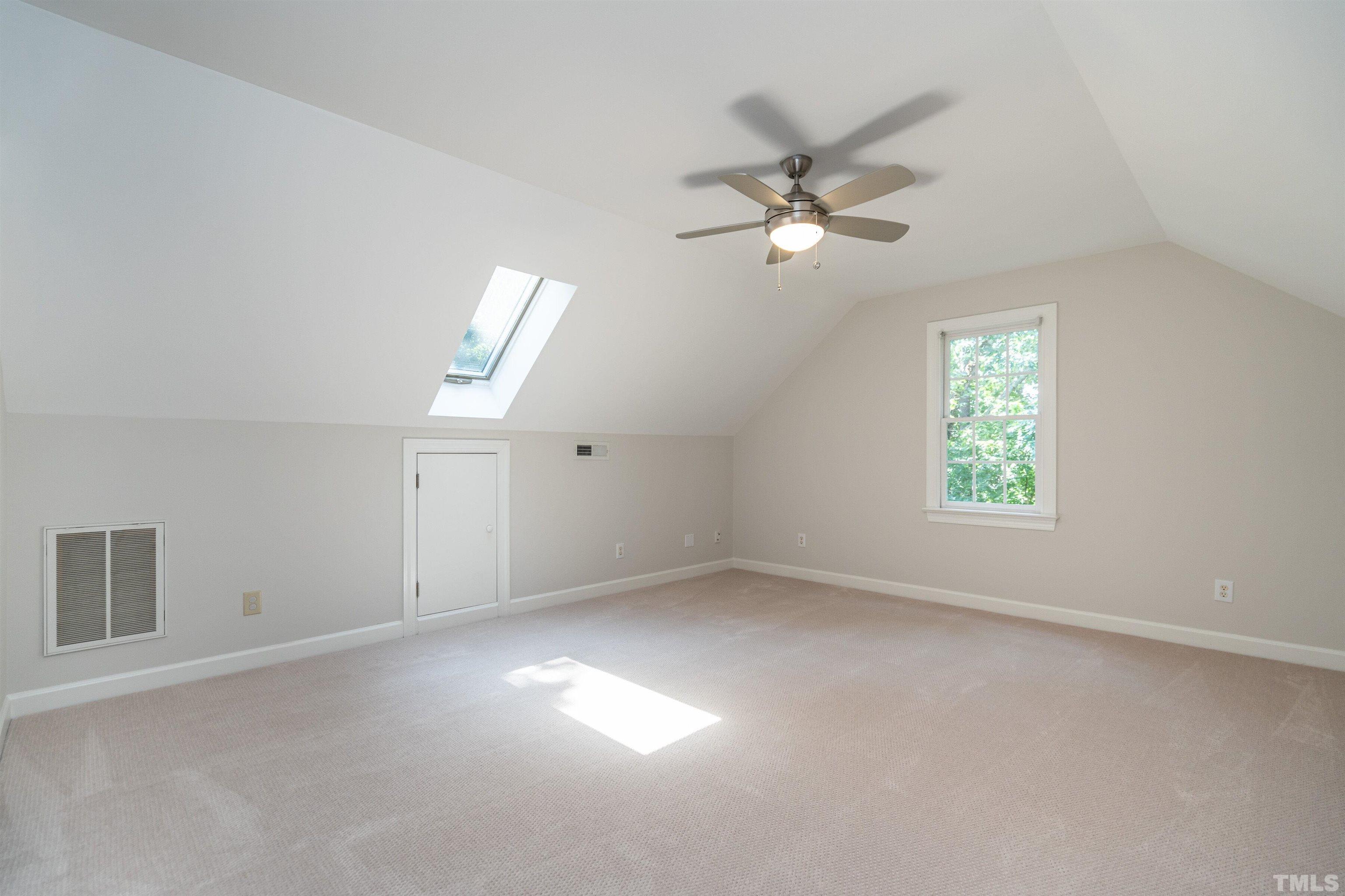 3016 Stone Gap Court Raleigh, NC 27612 - Photo 30 of 37 a view of empty room with window and ceiling fan