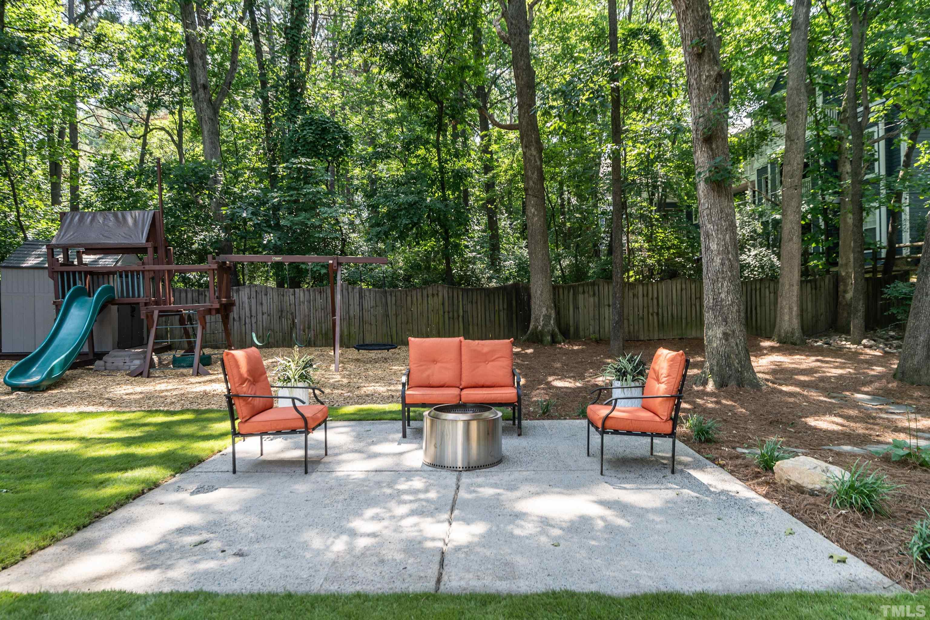 3016 Stone Gap Court Raleigh, NC 27612 - Photo 33 of 37 a backyard of a house with seating space