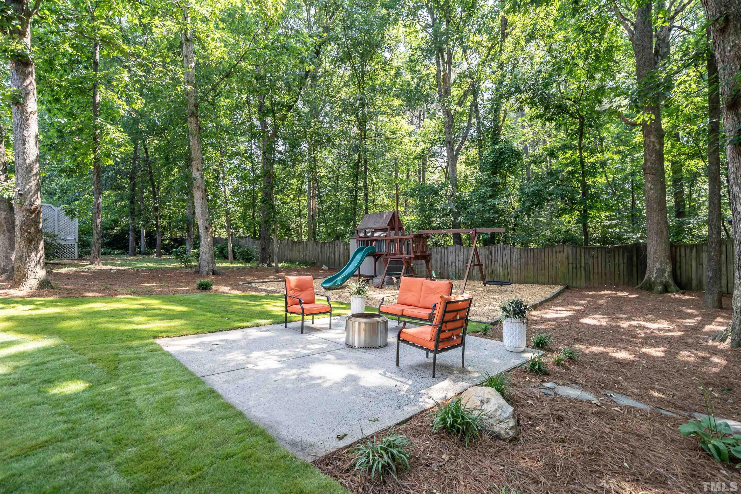3016 Stone Gap Court Raleigh, NC 27612 - Photo 34 of 37 a wooden bench sitting in the middle of a park
