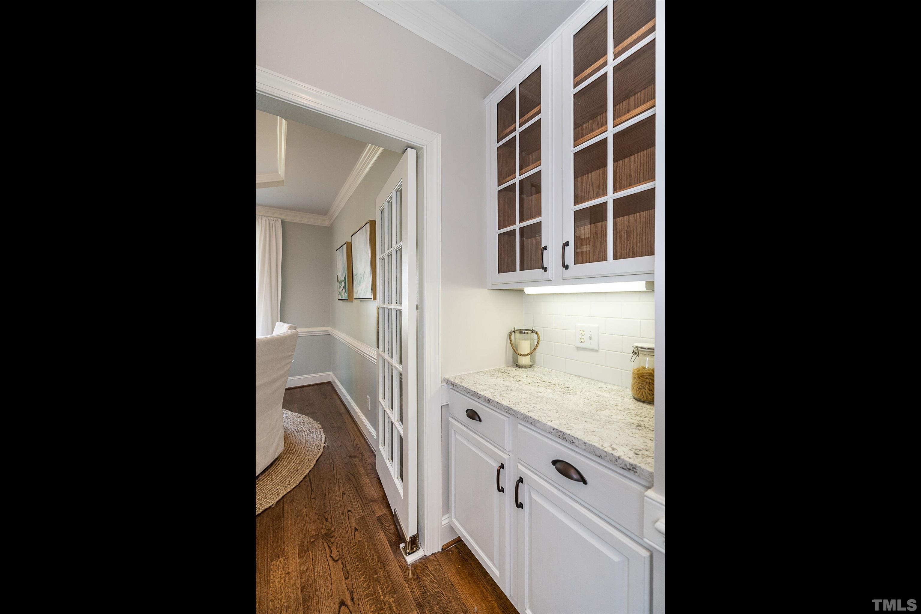 3016 Stone Gap Court Raleigh, NC 27612 - Photo 7 of 37 a view of cabinets with wooden floor