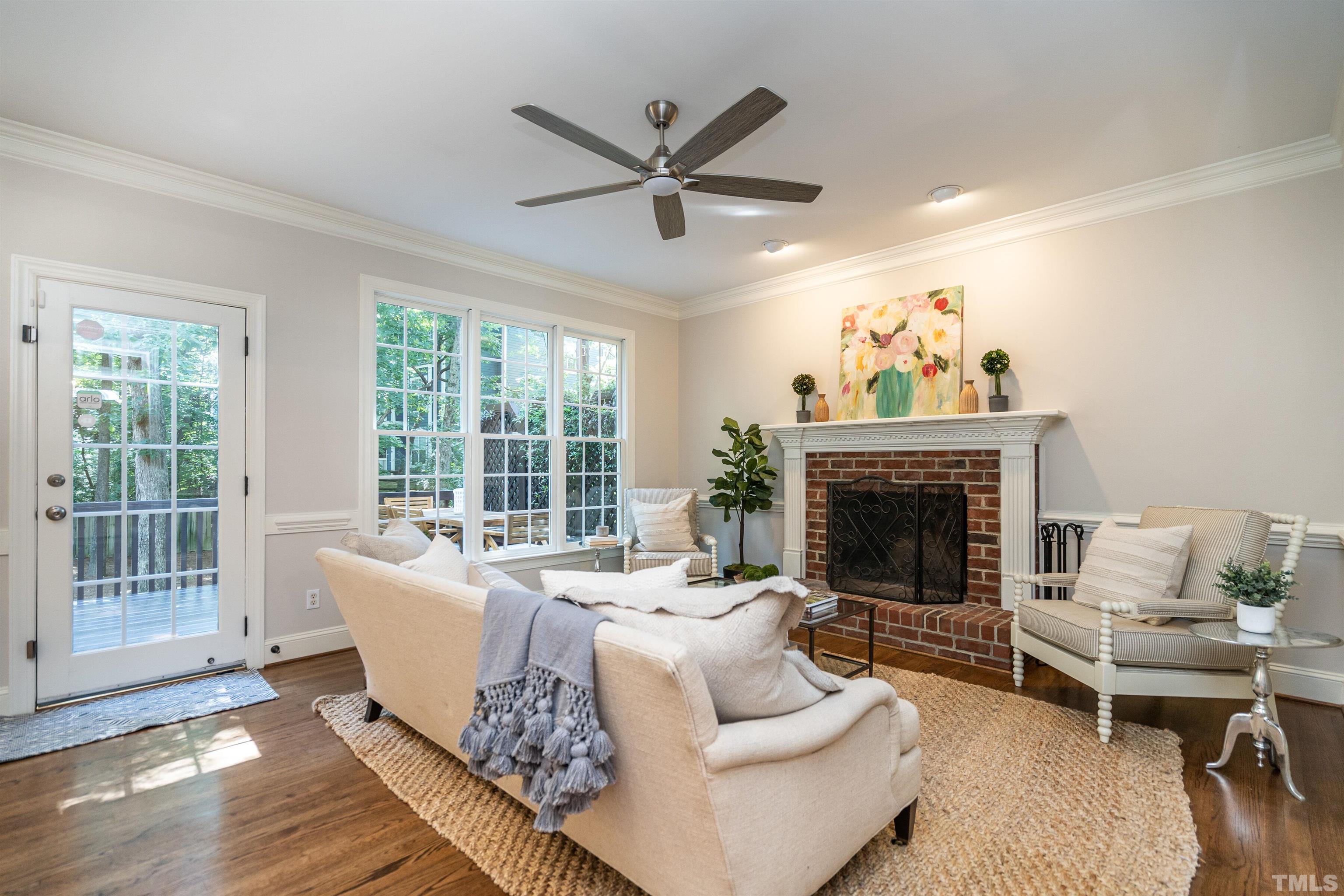 3016 Stone Gap Court Raleigh, NC 27612 - Photo 8 of 37 a living room with furniture and a fireplace