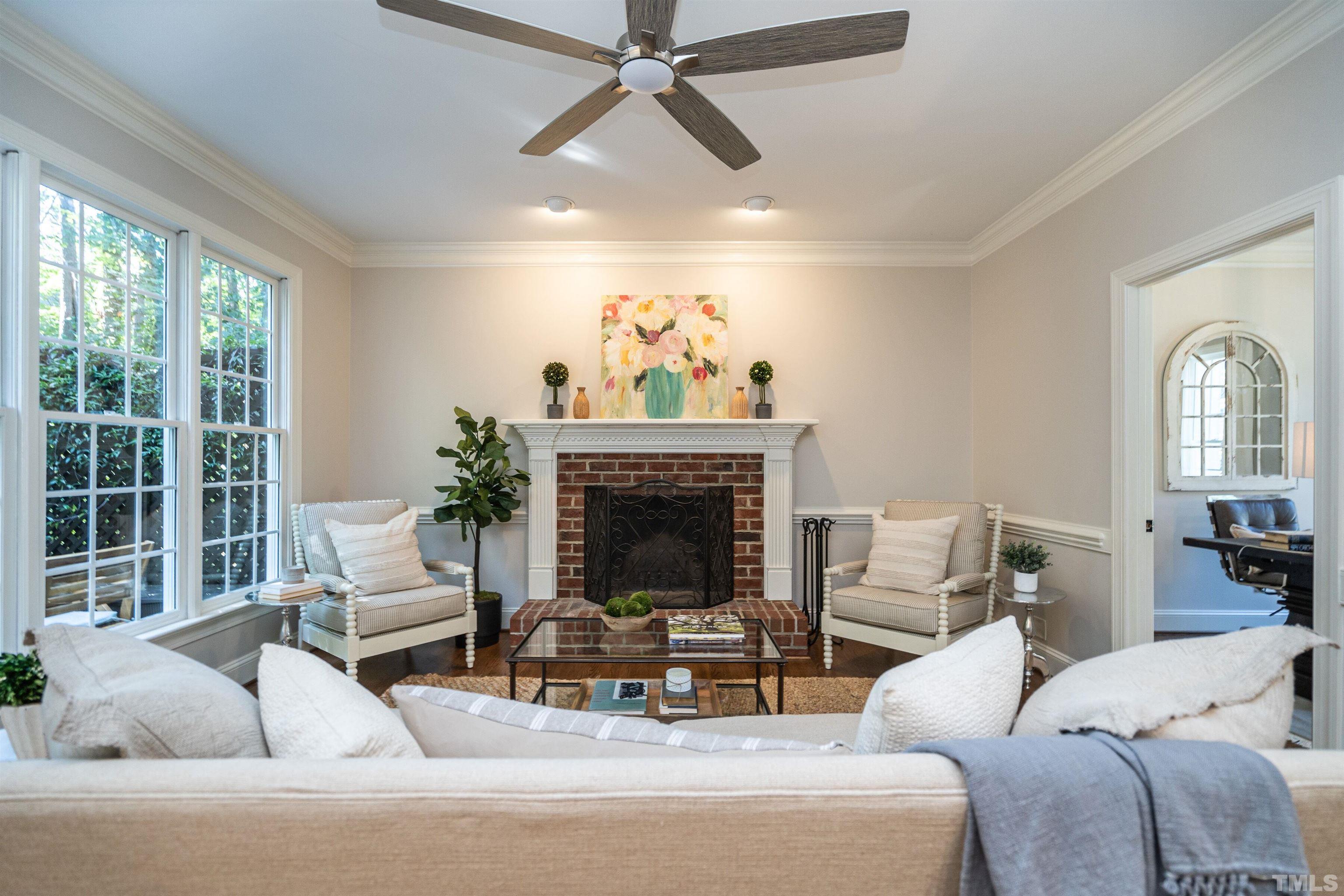 3016 Stone Gap Court Raleigh, NC 27612 - Photo 9 of 37 a living room with furniture fireplace and window