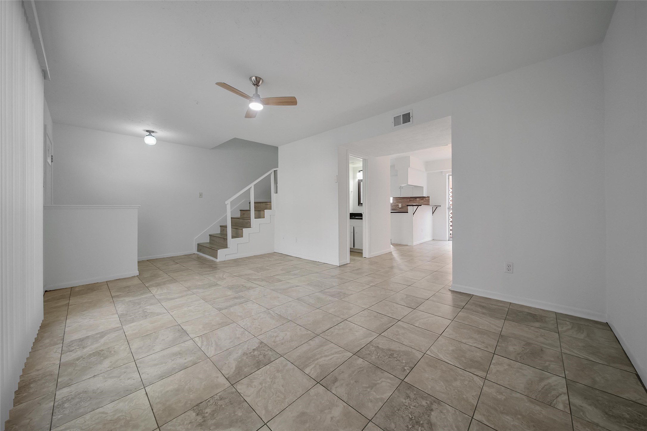 1403 Blalock Road, Unit 15 Houston, TX 77055 - Photo 6 of 21 a view of a big room with staircase and white walls