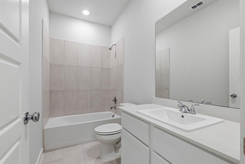 637 Sierra Ridge Lavon, TX 75166 - Photo 11 of 26 a bathroom with a sink toilet and shower