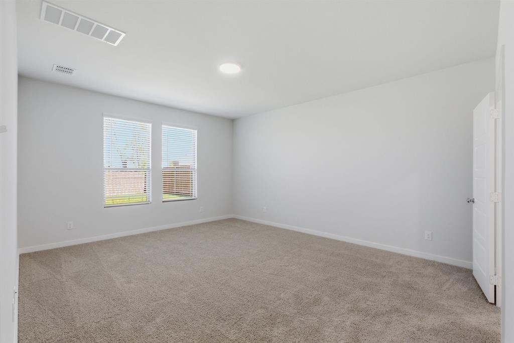 637 Sierra Ridge Lavon, TX 75166 - Photo 20 of 26 an empty room with a window