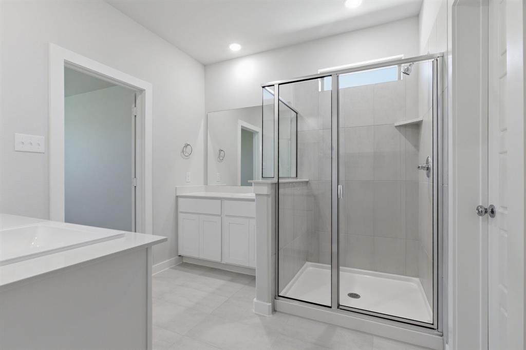 637 Sierra Ridge Lavon, TX 75166 - Photo 23 of 26 a bathroom with a shower