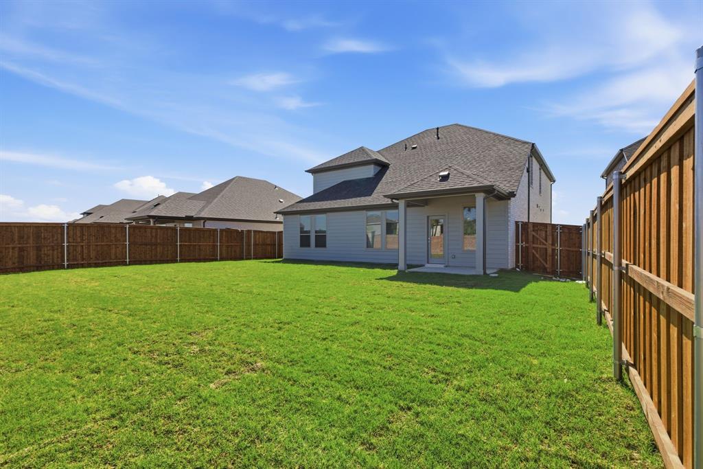 637 Sierra Ridge Lavon, TX 75166 - Photo 26 of 26 a front view of a house with garden