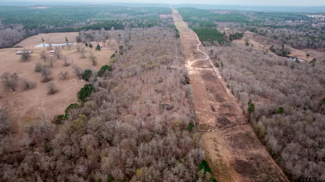 an aerial view of house with mountain view
