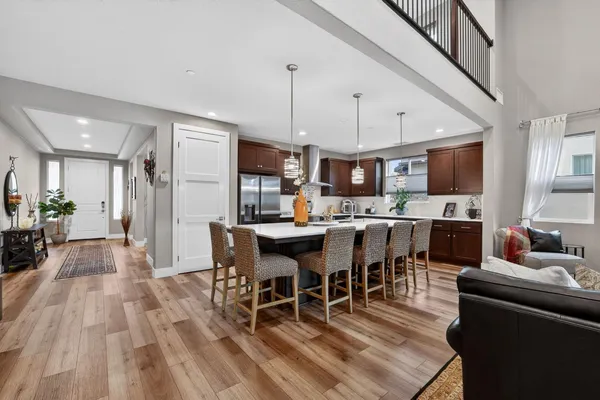 a large kitchen with a table and chairs