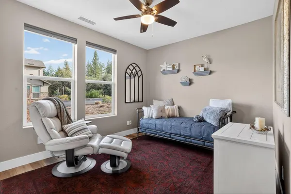 a living room with furniture and a window