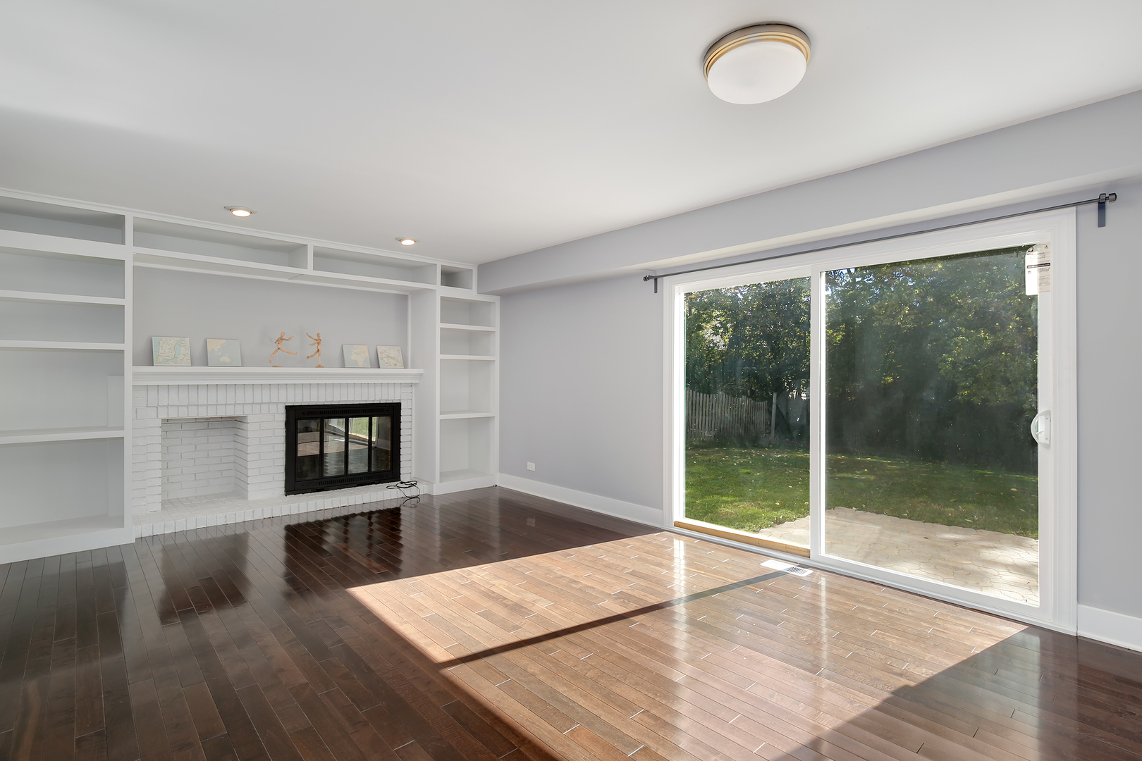 2827 Sun Valley Road Lisle, IL 60532 - Photo 14 of 33 a living room with furniture and a fireplace