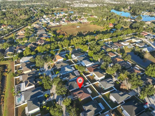 an aerial view of residential houses with city view