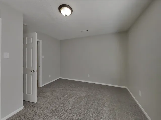 an empty room with a empty space and window