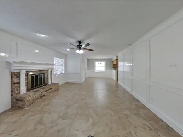 wooden floor in an empty room with a fireplace