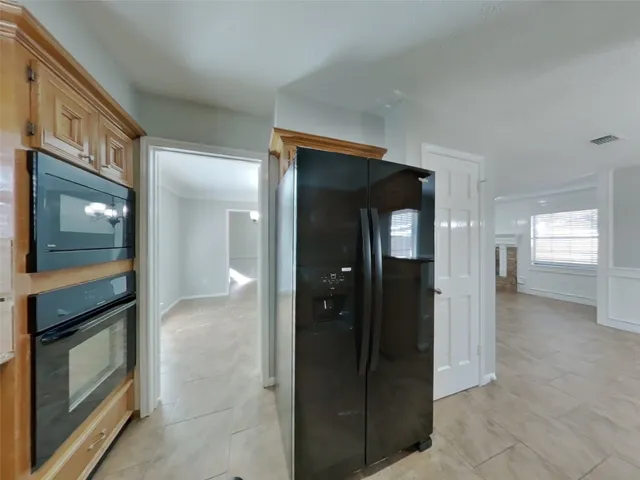 a view of an empty room and fire place