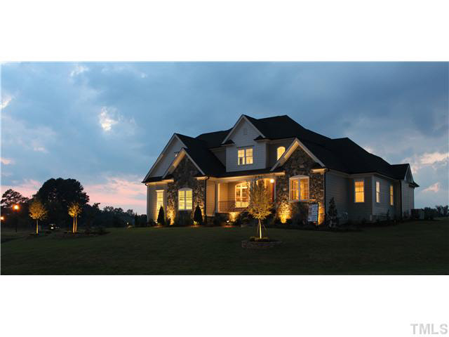 2613 Packhouse Road Zebulon, NC 27597 - Photo 1 of 25 At dusk custom up lighting in front trees and shrubs turns off automatically after 6 hrs.