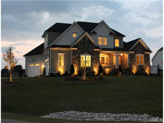 2613 Packhouse Road Zebulon, NC 27597 - Photo 2 of 25 Genuine stone accents on home front steps and front porch.