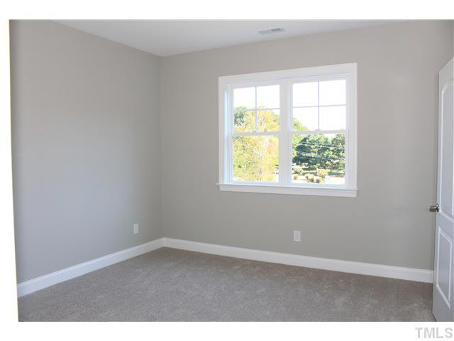 2613 Packhouse Road Zebulon, NC 27597 - Photo 21 of 25 Large secondary bedrooms 9ft ceiling's.